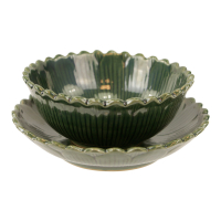 Kop met schotel keramiek rond bloem groen